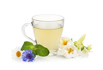 Aromatic herbal tea in glass cup, mint and flowers isolated on white