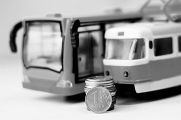 Russian coins and public transport toys, black and white image.