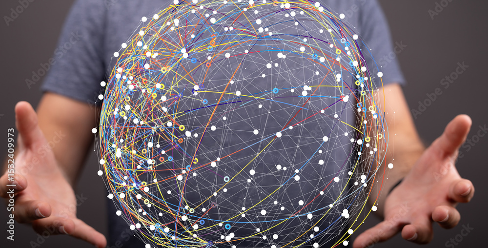 Poster A man holds a digital globe, showcasing interconnected nodes and lines. Represents global network, data flow, or connectivity.