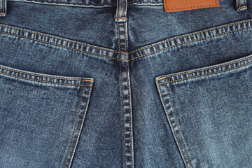 Jeans pants. back pocket of blue jeans, denim texture.