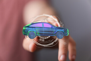 Person interacting with a digital car hologram.  Concept of automotive technology, innovation, and...