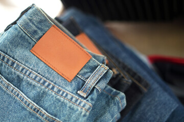 Jeans pants. Empty leather patch on blue jeans label.  space for writing. 