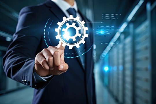 Businessman interacting with digital gear icon in a high-tech server room, showcasing innovation