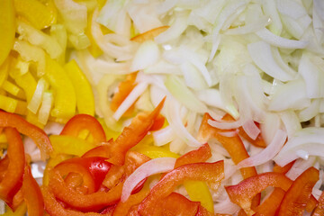 Mixed chopped vegetables for cooking, onion, yellow and red bell pepper, carrot