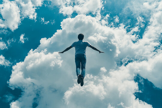 Man floating amidst fluffy white clouds blue sky above