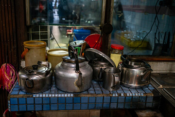 Bunch of tea pots kept on a stand