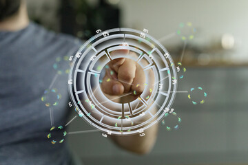 Person uses a holographic interface to analyze data.  Digital dashboard concept.