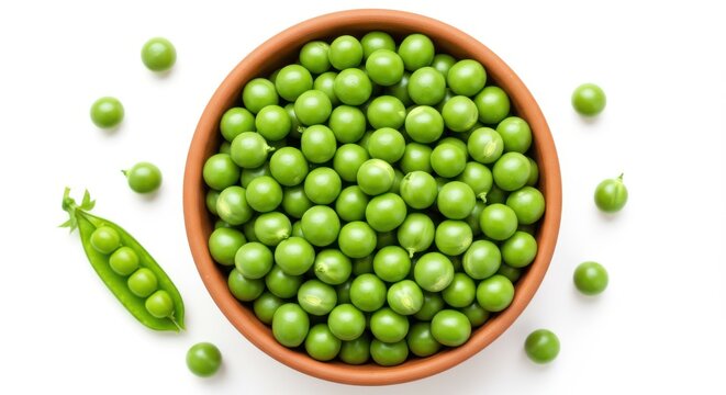Fresh green peas in a terracotta bowl with loose peas