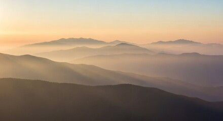 Serene Layered Mountain Peaks Emerging from Ethereal Mist at Dawn, Bathed in Soft Golden Light, Capturing the Majestic Beauty of a Tranquil Natural Landscape.