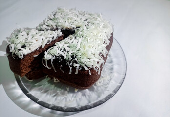 A piece of cake brownies brown with a sprinkling of cheese delicious