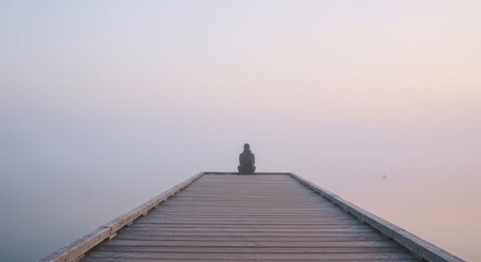 Solitude on a Misty Pier: A Serene Morning by the Lake