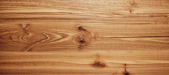 Close-up of wooden planks with visible grain and knots in a horizontal pattern.premium dark wood macro texture.