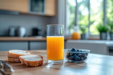 A glass of juice, bread, and blueberries sit on a wooden kitchen table. Perfect for healthy eating, breakfast, or a vibrant lifestyle concept.