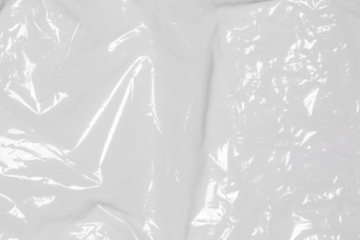 plastic overlay texture of realistic crumpled transparent plastic film wrap on black background,wrinkled stretched plastic effect.	