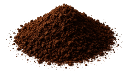 A pile of rich, dark cocoa powder forms a small mound with scattered particles around it.