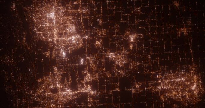Loveland, Fort Collins and Greeley (Colorado, USA) aerial view at night. Top view on modern city with glow effect. Camera is zooming out, rotating counterclockwise
