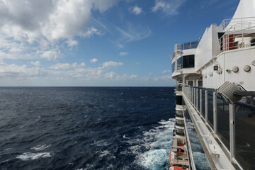 Outdoor promenade boat sun deck onboard modern luxury cruiseship cruise ship ocean liner with teak...