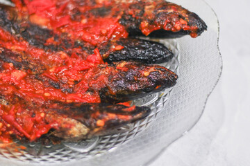 pindang or boiled fish coated in spicy chili sauce