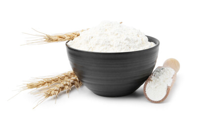 Wheat flour and spikes isolated on white