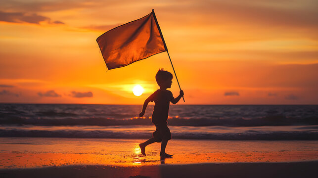 Silhouette of a child running with a flag on the beach at sunset