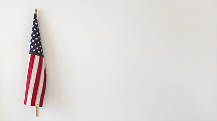 Minimalist photo of flag hanging on clean white wall