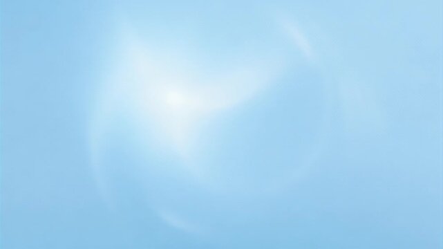 white sunlight glowing through a pale blue sky