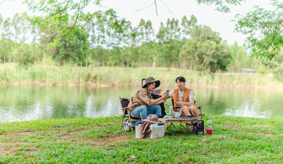 Charging Phone with Solar Power at Lakeside Picnic