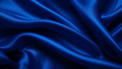 Obraz premium Dark blue flowing satin silk fabric with a smooth, luxurious, and shiny rippled texture