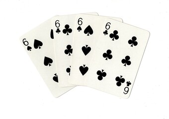 A hand of four black playing cards of the same value on a white background.