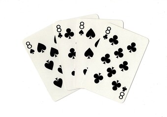 A hand of four black playing cards of the same value on a white background.