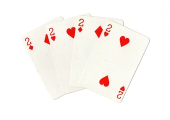 A hand of four red playing cards of the same value isolated on a white background.