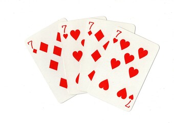 A hand of four red playing cards of the same value isolated on a white background.