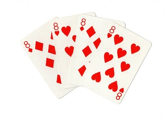 A hand of four red playing cards of the same value isolated on a white background.