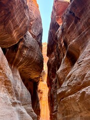 A breathtaking view of a narrow canyon that showcases stunning and majestic rock formations in nature