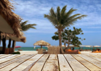 Wooden table top on the beach or sea.Party on the beach  sunshine time concept.For montage product display or design key visual layout.View of copy space.