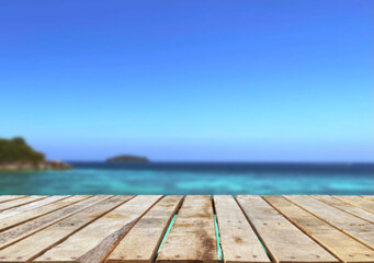 Wooden table top on the beach or sea.Party on the beach  sunshine time concept.For montage product display or design key visual layout.View of copy space.