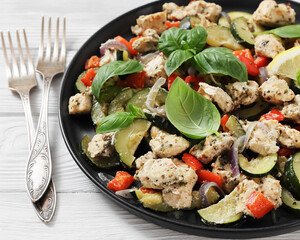baked italian chicken and vegetables on a plate