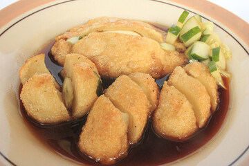 Delicious Indonesian Pempek Palembang (Fish Cake) with Sweet and Sour Cuako Sauce