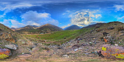 Full 360 by 180 degrees panorama of rocky mountainous landscape at spring day in Kyrgyzstan in...