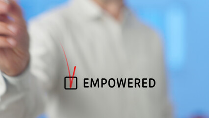 Businessman is checking a box with a red tick mark, symbolizing the concept of empowerment in a...