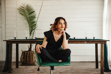 Woman sitting in a desk chair indoors