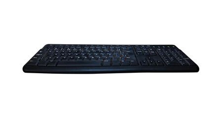 Old black keyboard isolated on transparent PNG background, angled view