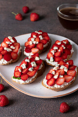 Bruschetta with strawberries, arugula and dor blue cheese for breakfast