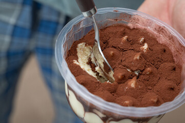 Indulge in a Delicious Tiramisu Dessert beautifully presented in a Clear Container