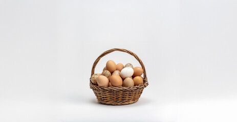 Wicker basket filled with farm eggs symbolize rural living and self sufficiency in a peaceful countryside setting.