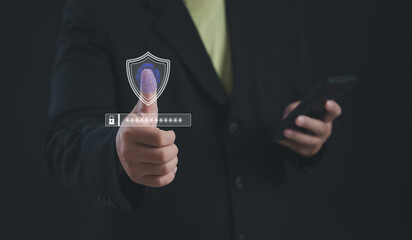 User verifying identity with fingerprint scan and virtual shield icon on smartphone screen,...