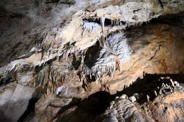 Inside of beautiful old dark cave with many stalactites. Grotte di Is Zuddas, Italy, Sardinia