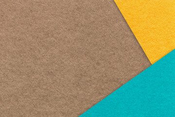 Fototapeta premium Abstract dark brown, yellow and turquoise paper background with copy space. Template for presentation and banner