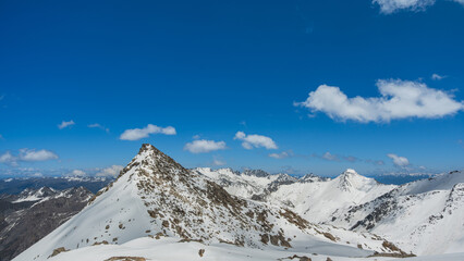 Landscape of snow-capped mountain peak white blue sky