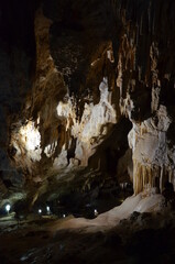 Inside of beautiful old dark cave with many stalactites. Grotte di Is Zuddas, Italy, Sardinia